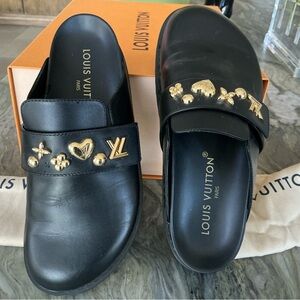 Louis Vuitton Black Mules with Gold Embellishments